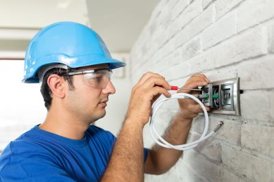 Technician inspecting a TV